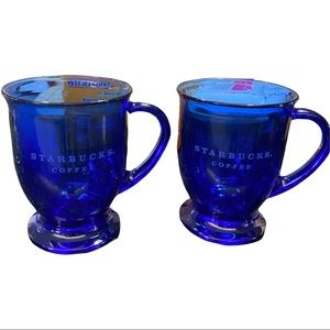 Two blue glass Starbucks latte coffee cups